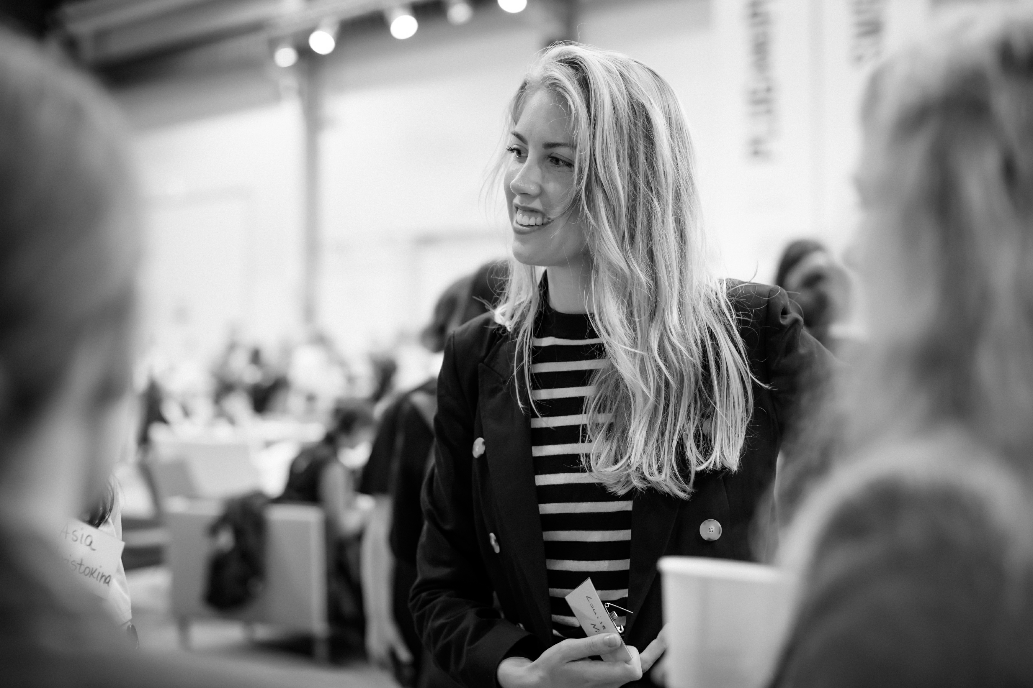 Louise Cuvillier in conversation at a conference